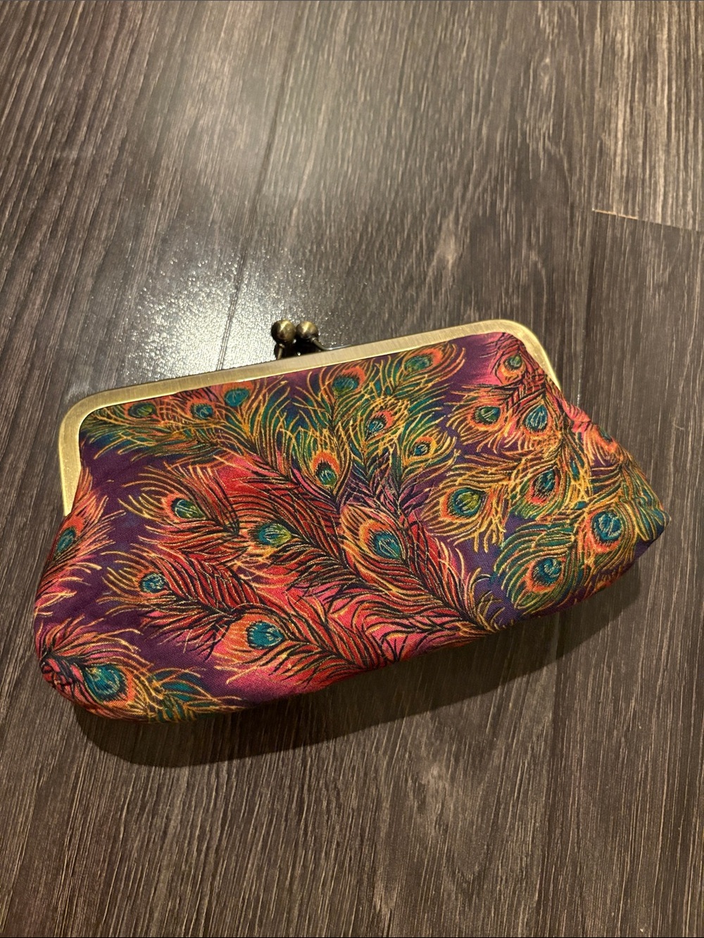Clutch that! Peacock soft clutch